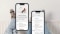The image shows the app screen of Savings Assistant and, in the background, three pairs of legs leaning against a radiator.